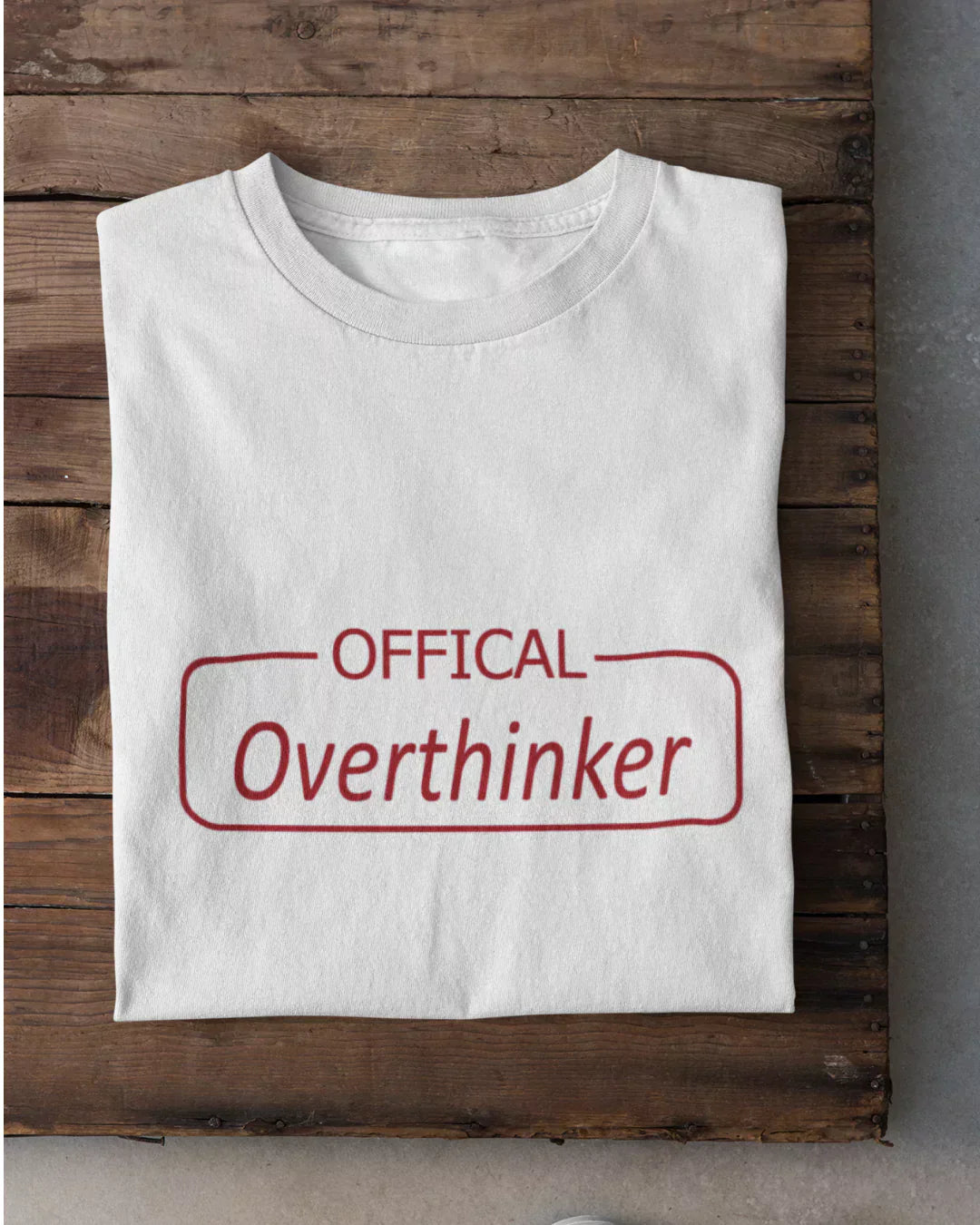 Official Overthinker T-Shirt – white regular tee with red OFFICIAL above Overthinker inside a rounded rectangle, flat lay