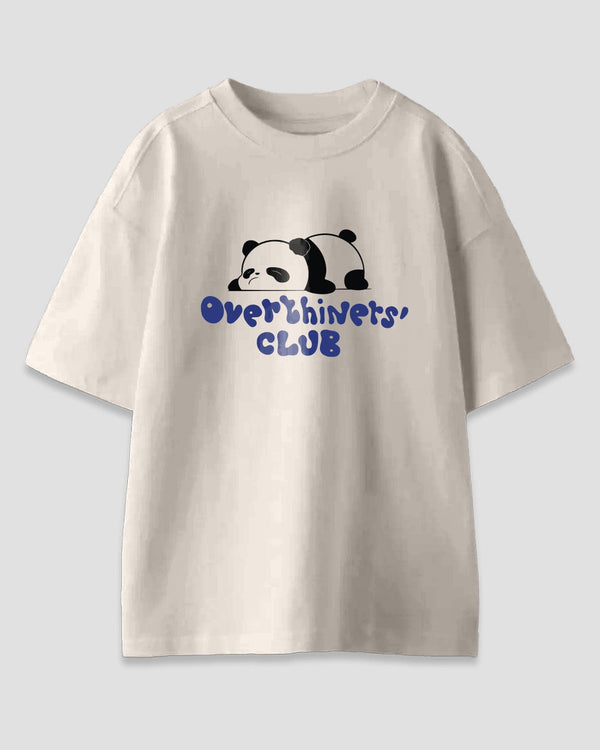 Overthinkers Club Oversized T-Shirt – cream/off-white with a panda graphic and blue text reading Overthinkers' CLUB, shown in flat lay
