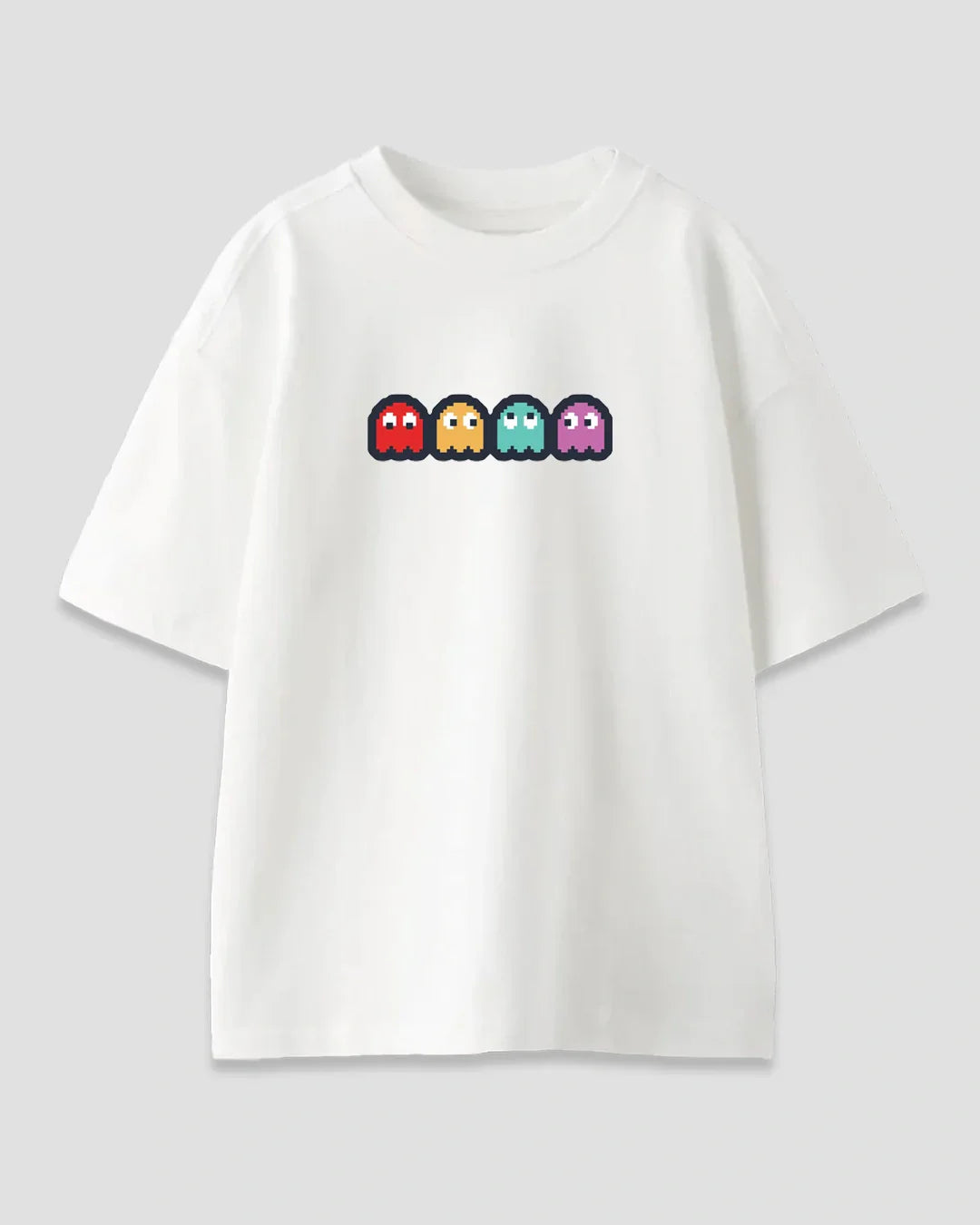 Paccy Oversized T-Shirt – white oversized tee with DKY Pac-Man ghost graphic in red, yellow, teal and purple, flat lay