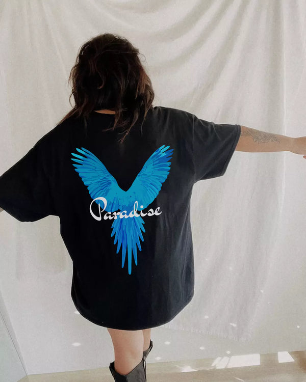 Arlo Paradise Oversized Tshirt – black oversized Tshirt with blue wing print, worn by model