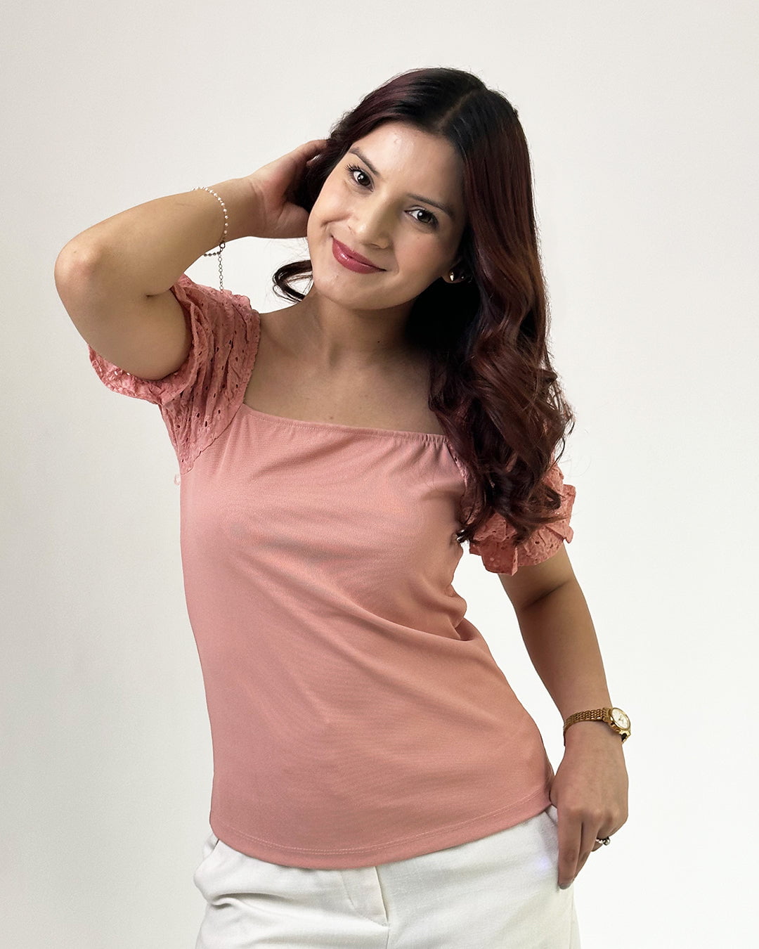 Peach Ruffle Top by DKY – peach color, slightly fitted top with lace-trimmed puff sleeves, worn by model