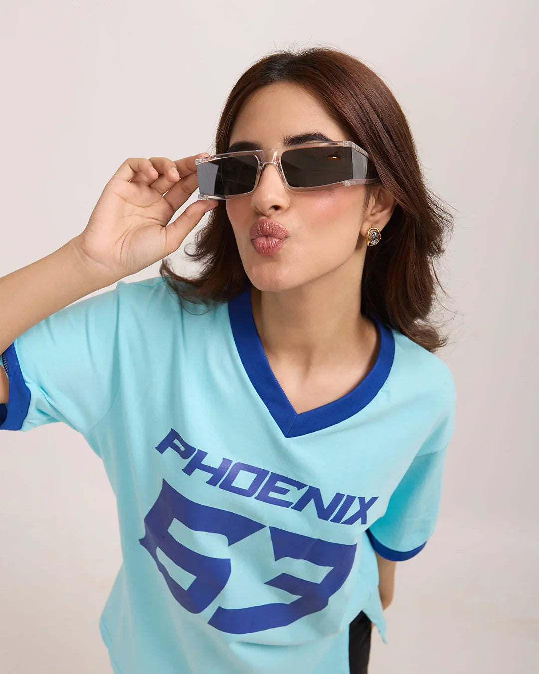 Phoenix Tap-Out V-Neck Oversize T-Shirt by DKY – light blue oversized V-neck tee with a bold Phoenix graphic on the front