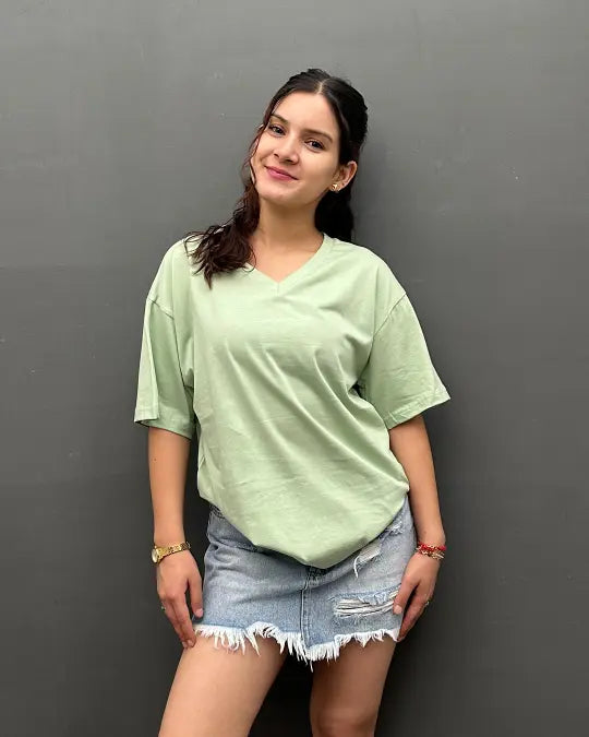 RB Pista Plain V-Neck Oversize T-Shirt by Real Baysics in sage green, 100% pure fabric, shown with a denim mini skirt