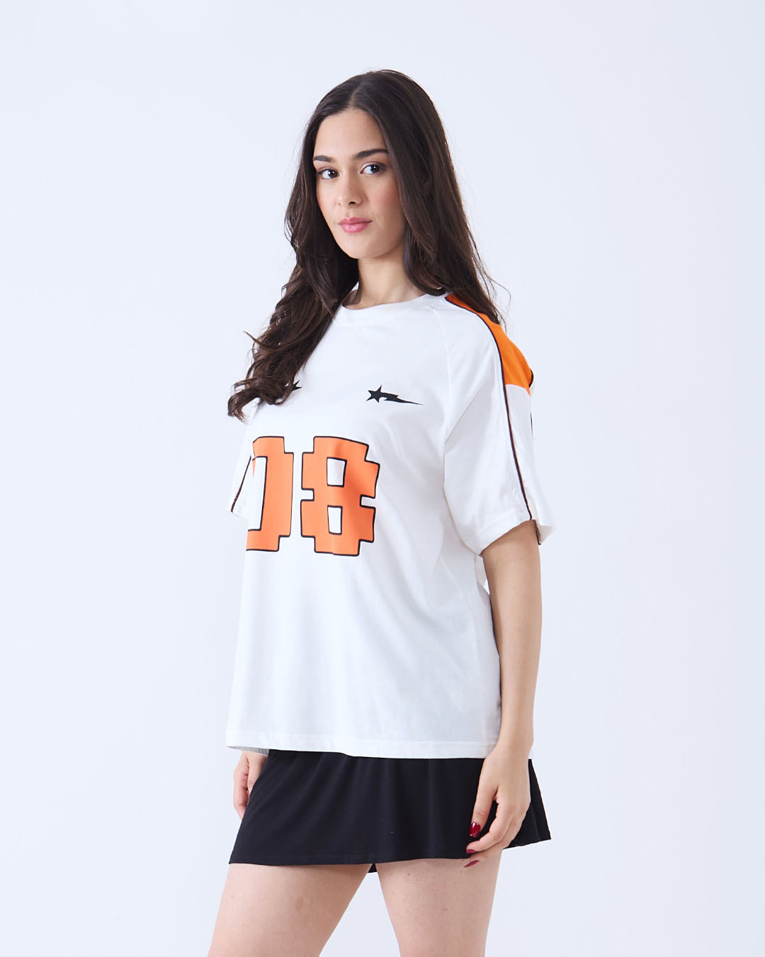 Pray Downtown Oversize T-Shirt – white oversized Raglan t-shirt with orange panels, large orange 08 graphic on front, worn by model