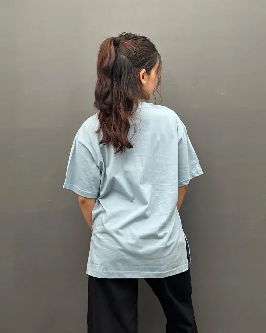 RB Cloudy Blue Plain OS Tee, oversized short-sleeve shirt in 100% pure fabric, back view.