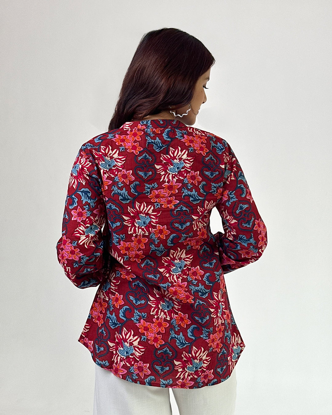 Red Vaani High Low Short Kurti – red relaxed printed kurti with floral pattern, worn by model