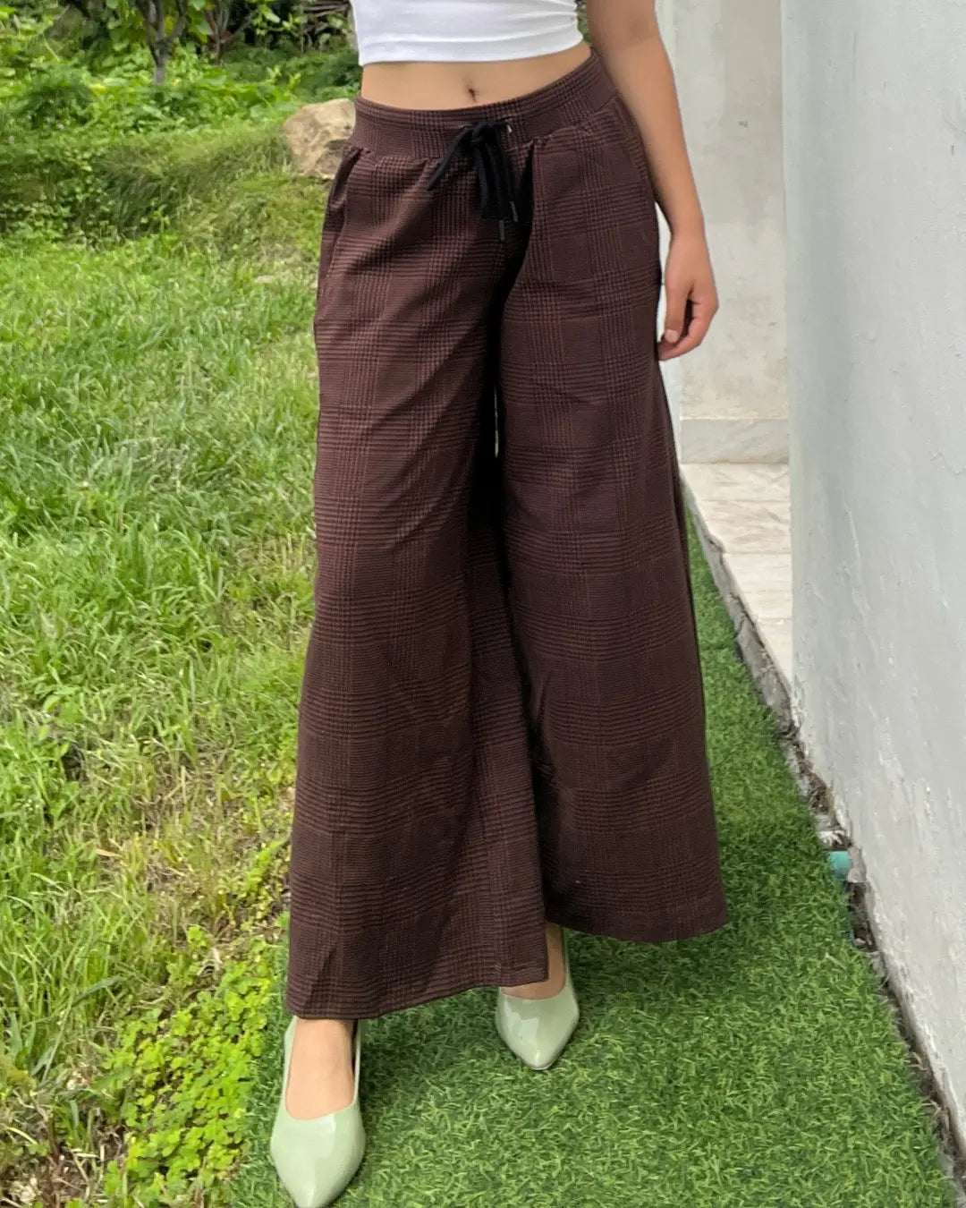 Rustic Pajama – brown plaid wide-leg pajama pants with drawstring, worn by model