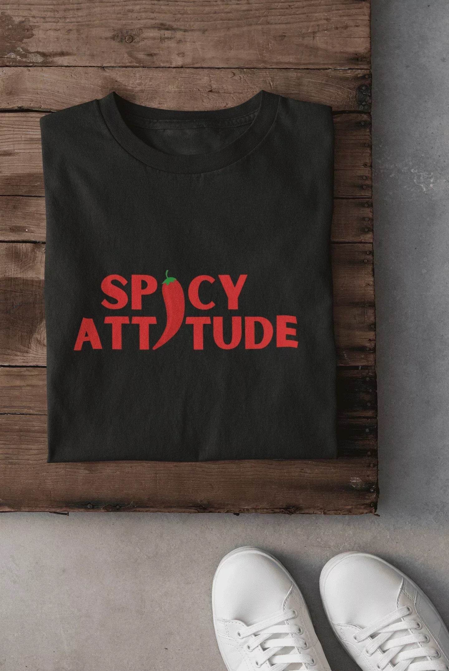 Spicy Attitude T-Shirt – black regular tee with red pepper graphic and text, shown in flat lay