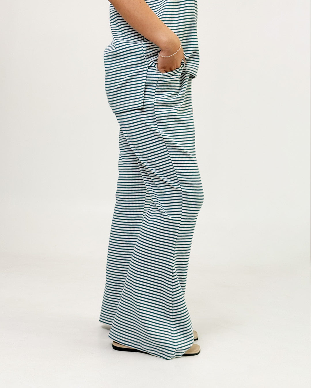 Teal Blue Ribbed Co-Ord Set – teal blue and white striped ribbed co-ord with relaxed fit, worn by model