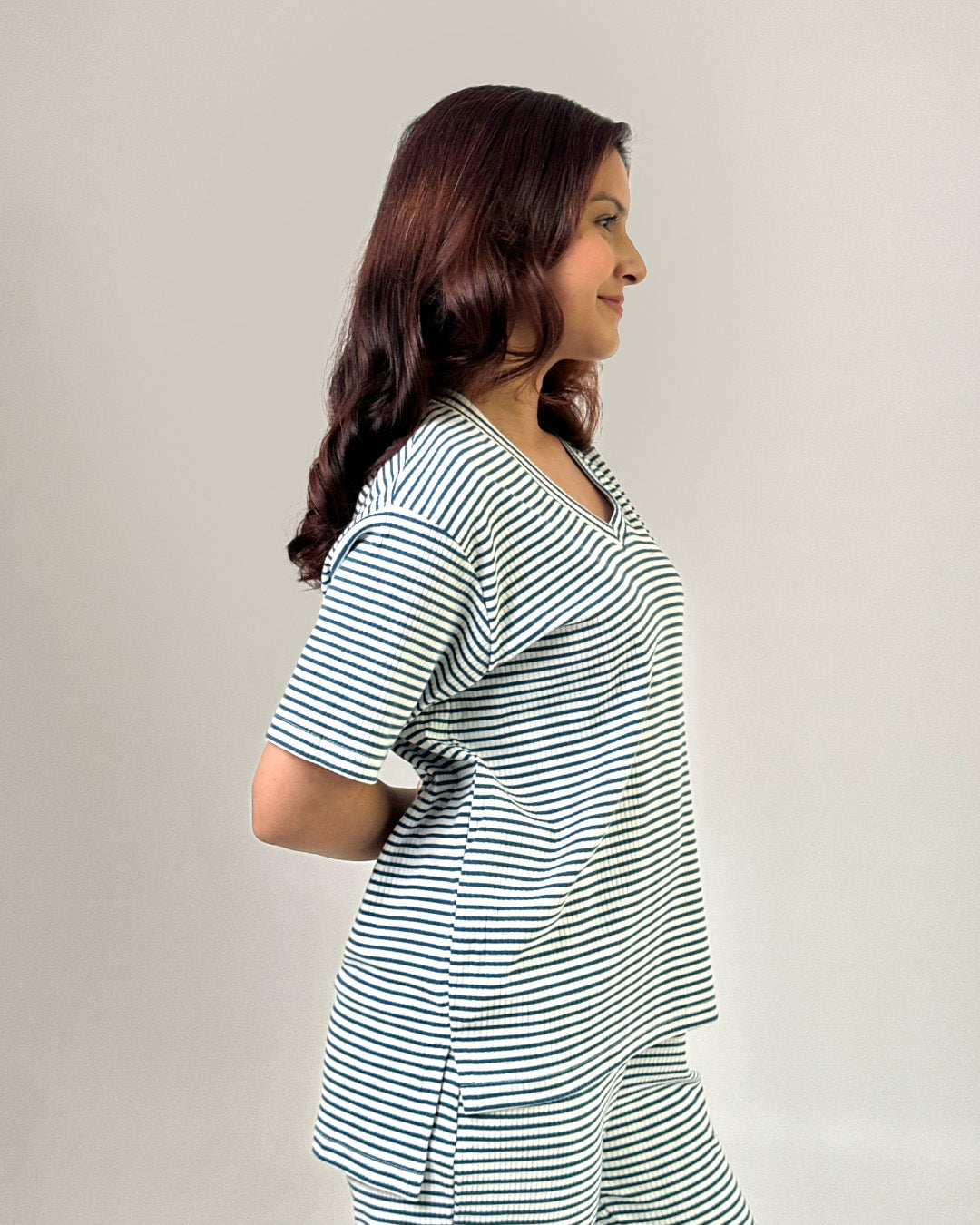 Teal blue ribbed co-ord set with a matching striped top and shorts worn by a model.