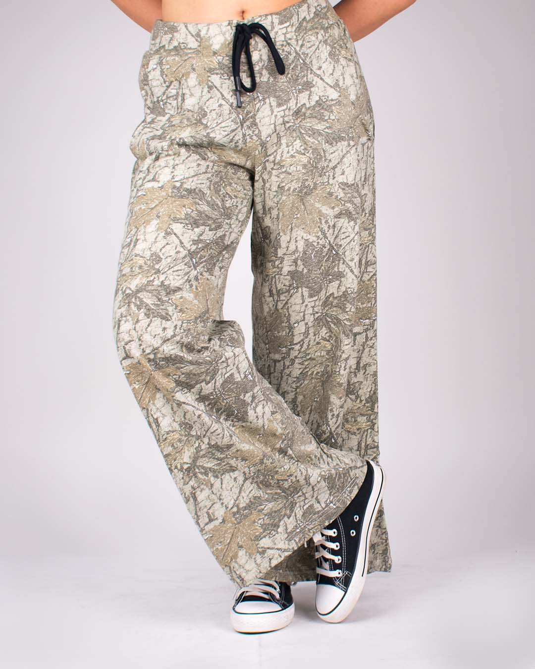 Treetide Pajama pants – beige camouflage, wide-leg with drawstring, worn by model.