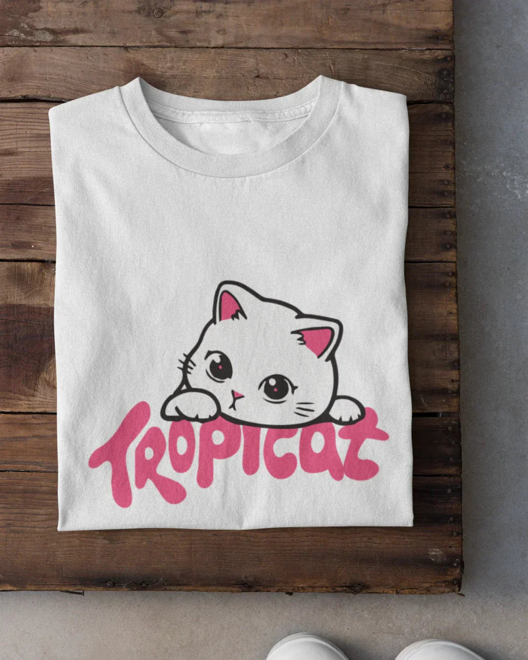 Tropicat T-Shirt – white regular tee with a cute cat graphic and pink Tropicat text, shown in flat lay