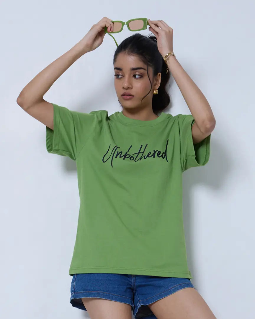 Unbothered Oversized T-Shirt – green oversized tee with Unbothered text, worn by model
