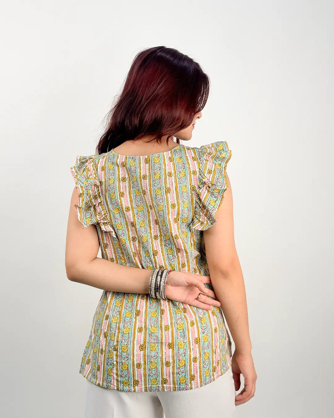White Laila Ruffle Short Kurti – multicolor striped floral print with ruffle sleeves, worn by model